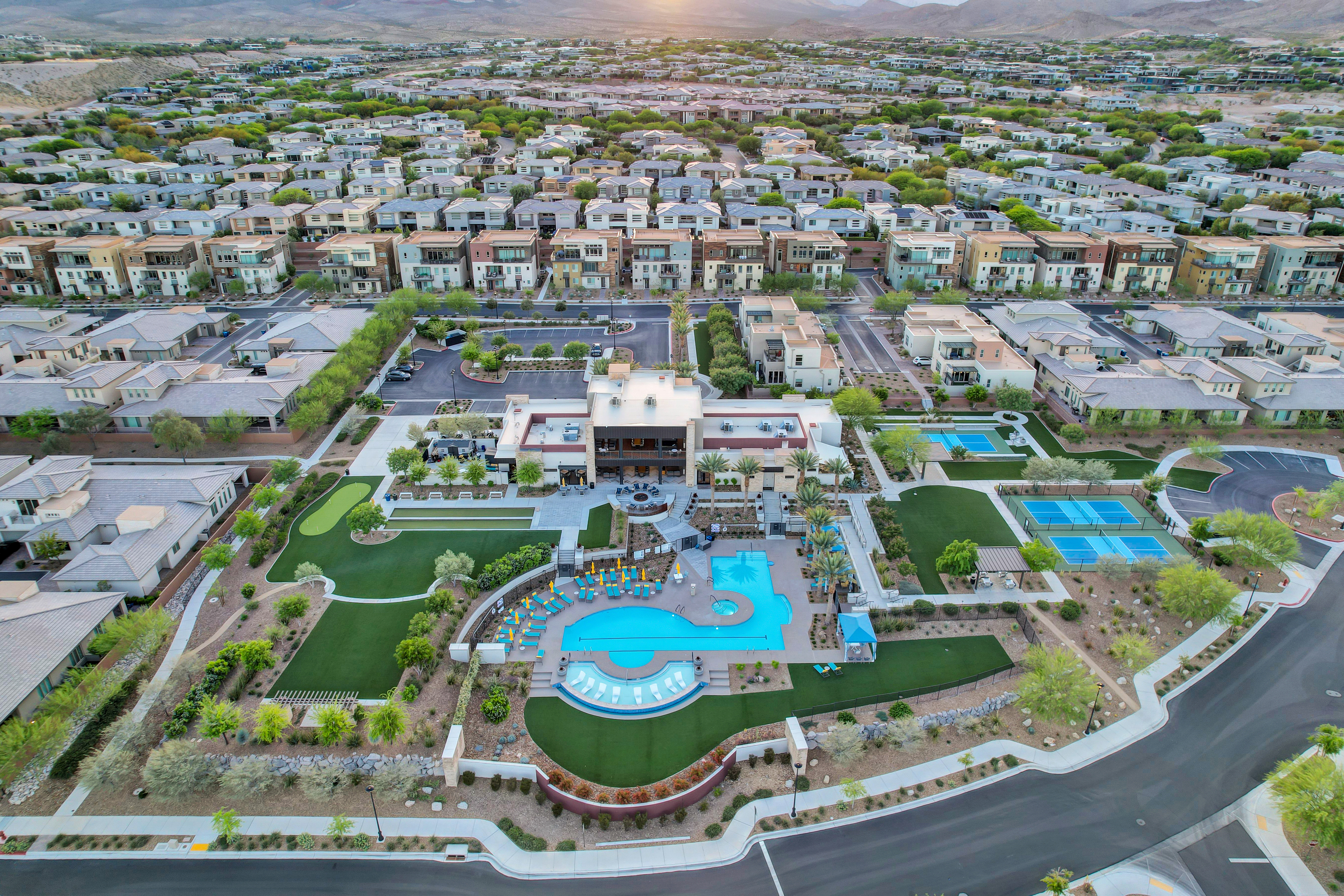 Aerial view of the Outlook Club showing the putting green, bocce lawn, resort pool, spa, and pickleball courts at Trilogy in Summerlin