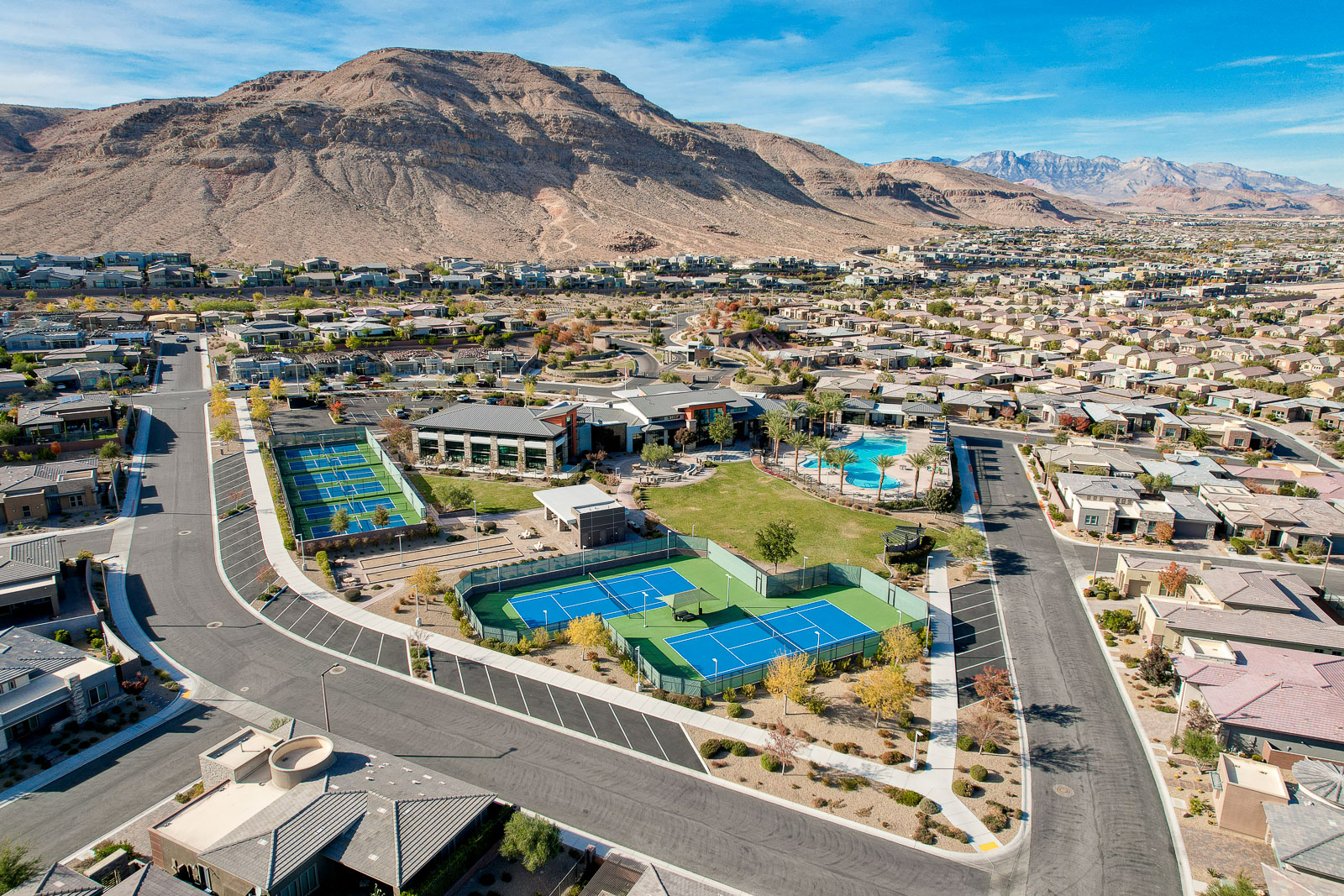 Aerial view of Regency's tennis and pickleball courts with mountain views in the background