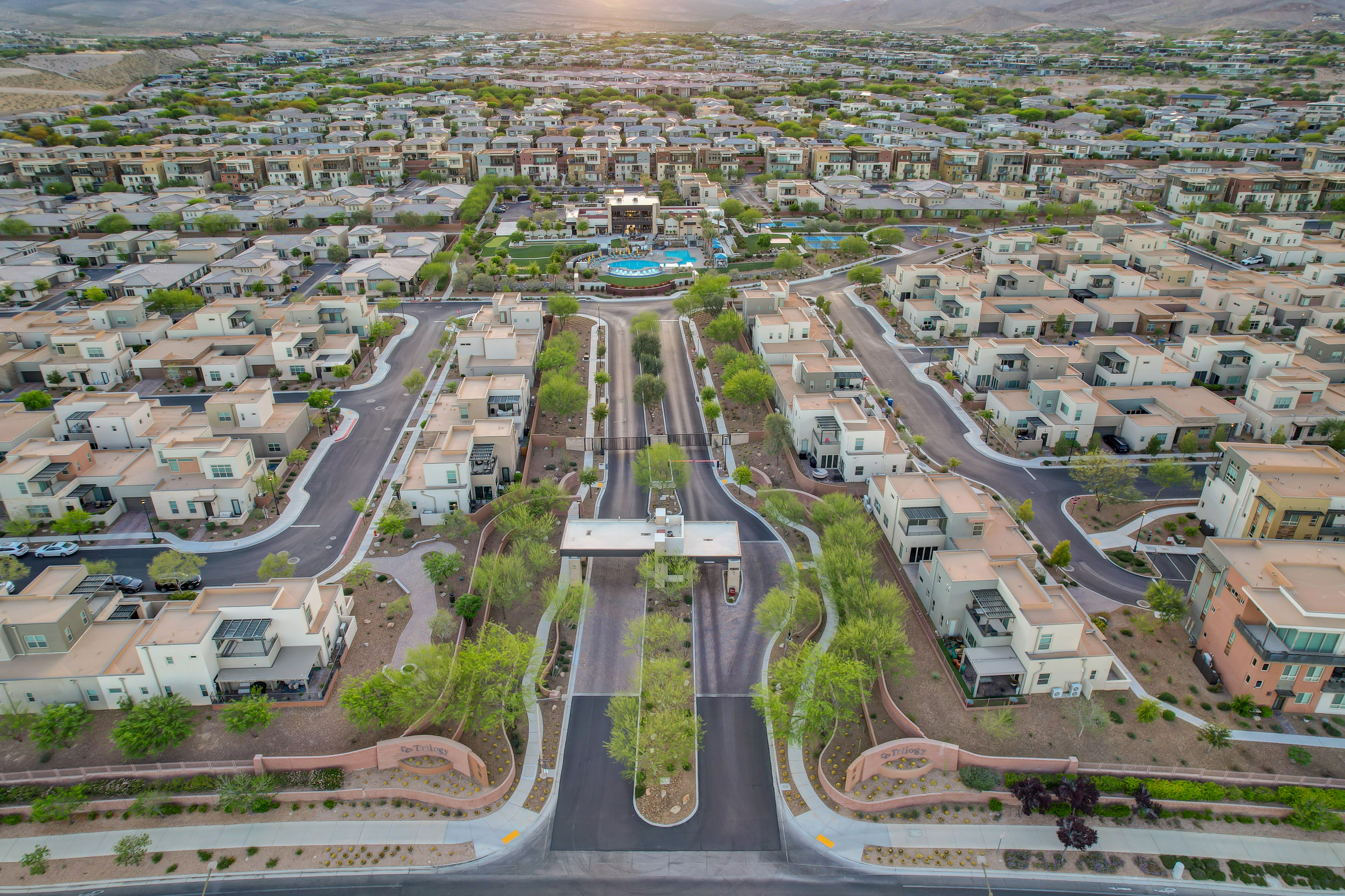 Aerial view of Trilogy's guard-gated entrance and gatehouse with the community's tree-lined main street in Las Vegas, Nevada