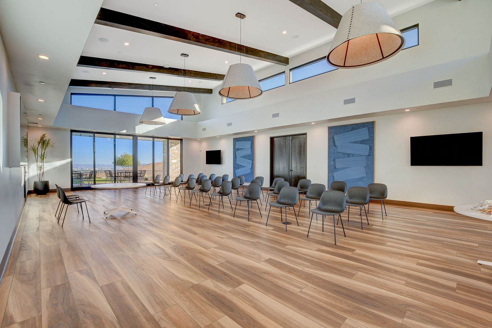 Multipurpose gathering room set up with rows of chairs at the Heritage at Stonebridge clubhouse