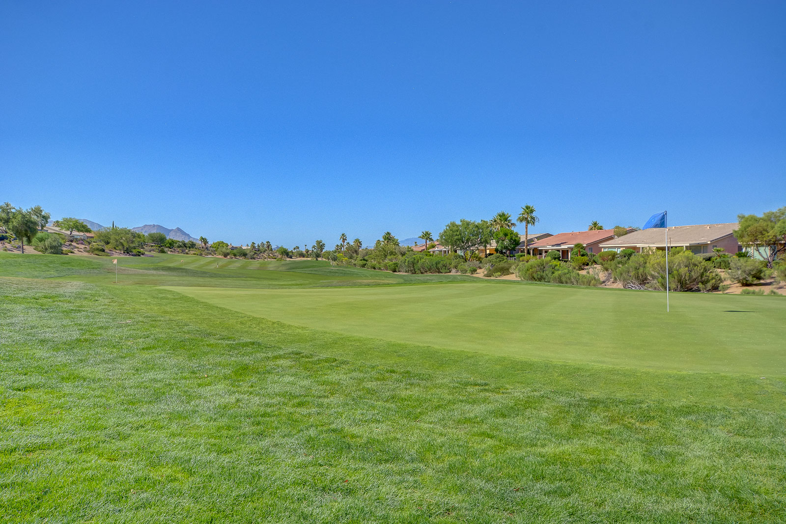 Open fairway and green at Siena Golf Club bordered by homes in Las Vegas, Nevada