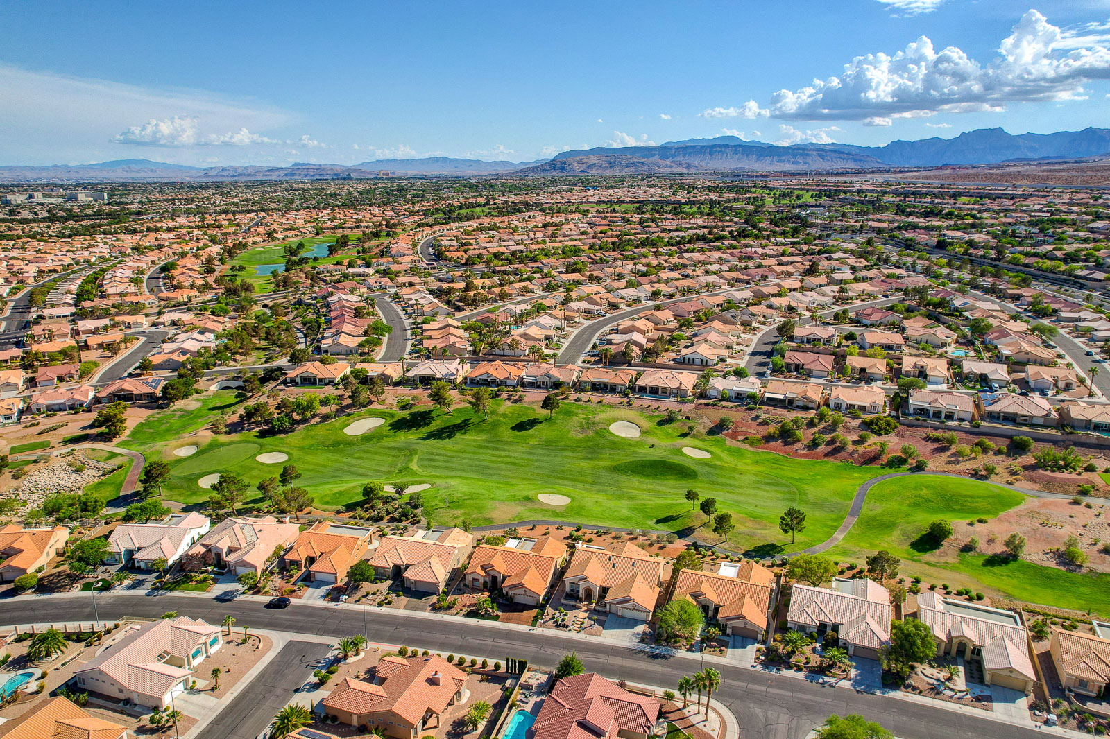 Aerial view of Sun City Summerlin homes bordering a golf course in Las Vegas, Nevada