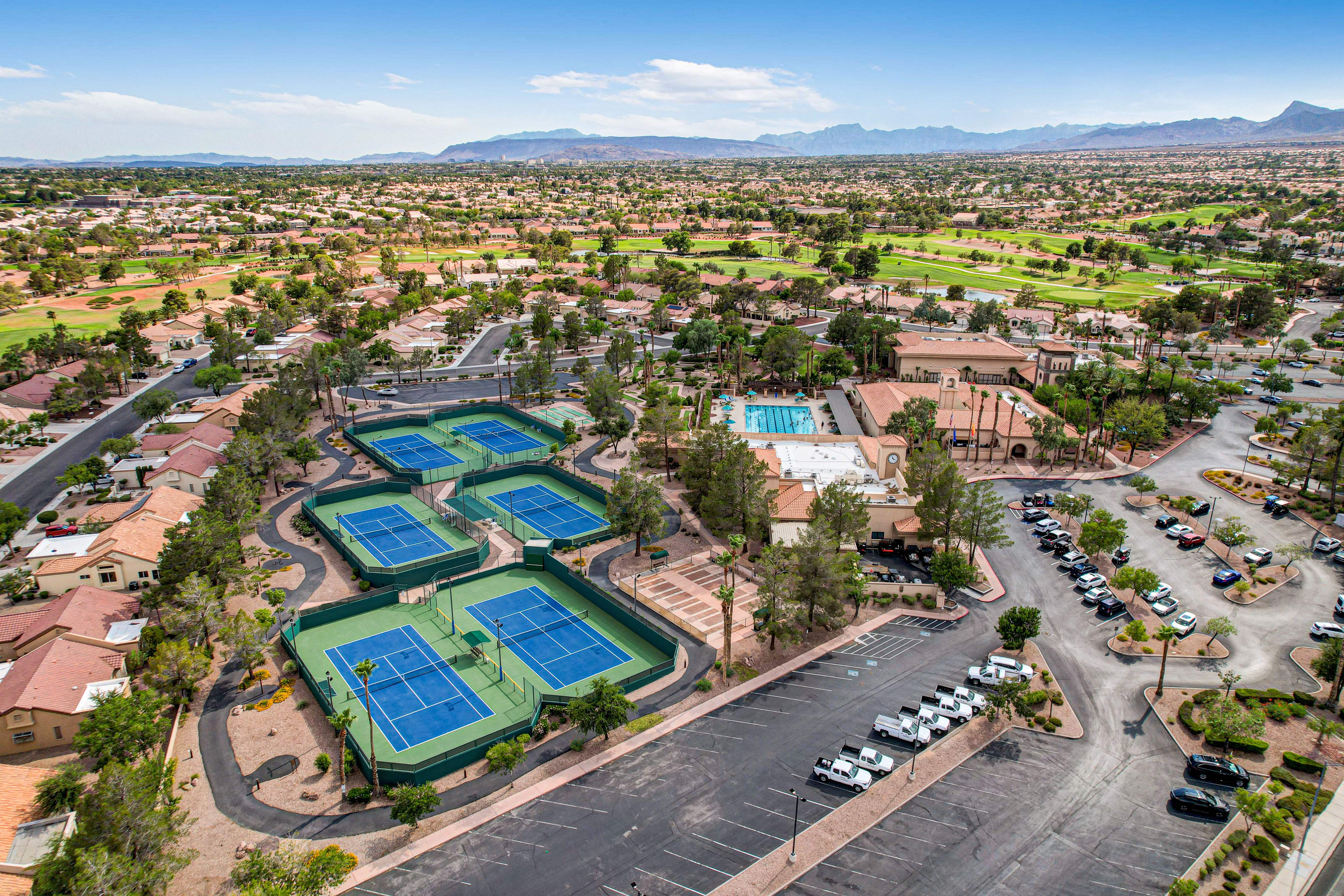Aerial view of Sun City Summerlin neighborhood showing recreation courts and community pool in Las Vegas, Nevada
