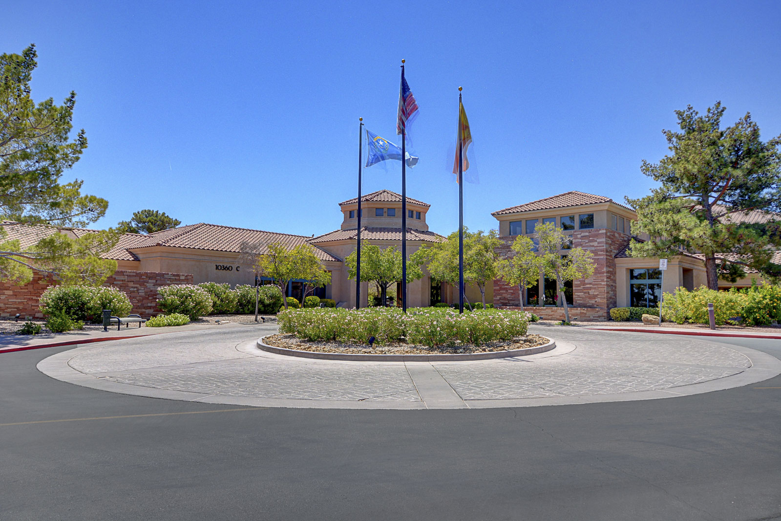 Clubhouse exterior with flags at Sun City Summerlin in Las Vegas, Nevada